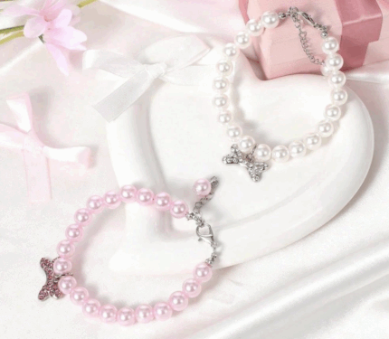 Collar de perlas c/dije de huesito. Talle S